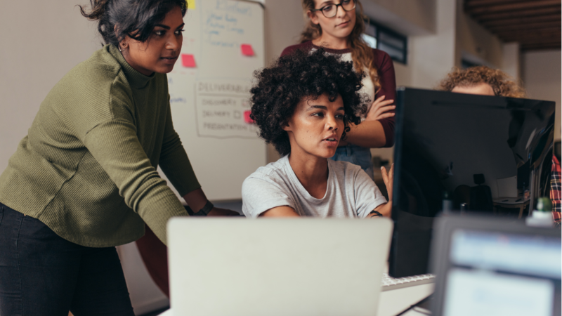 Three women working at a computer - broadcasting jobs