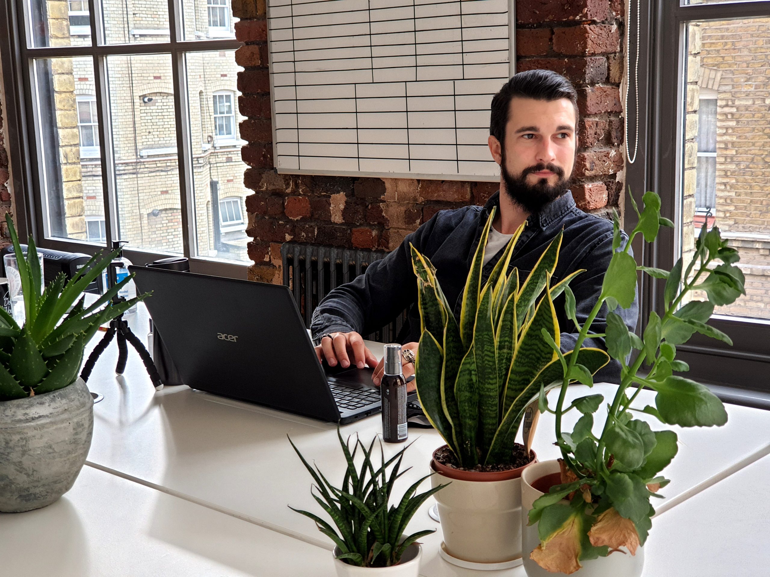 Joe James sitting at his desk - Creative Recruitment London