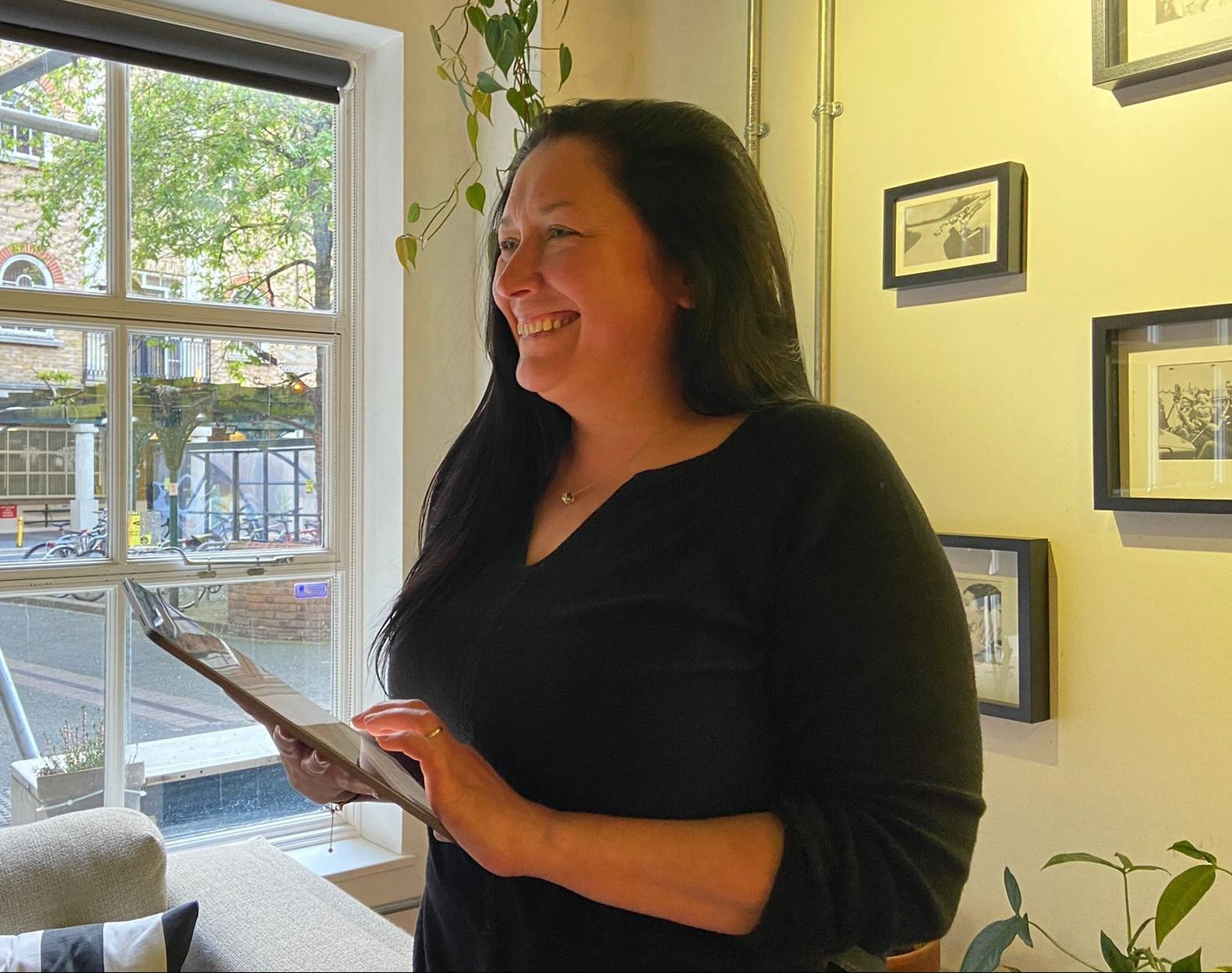 Mo Newman smiling with her ipad