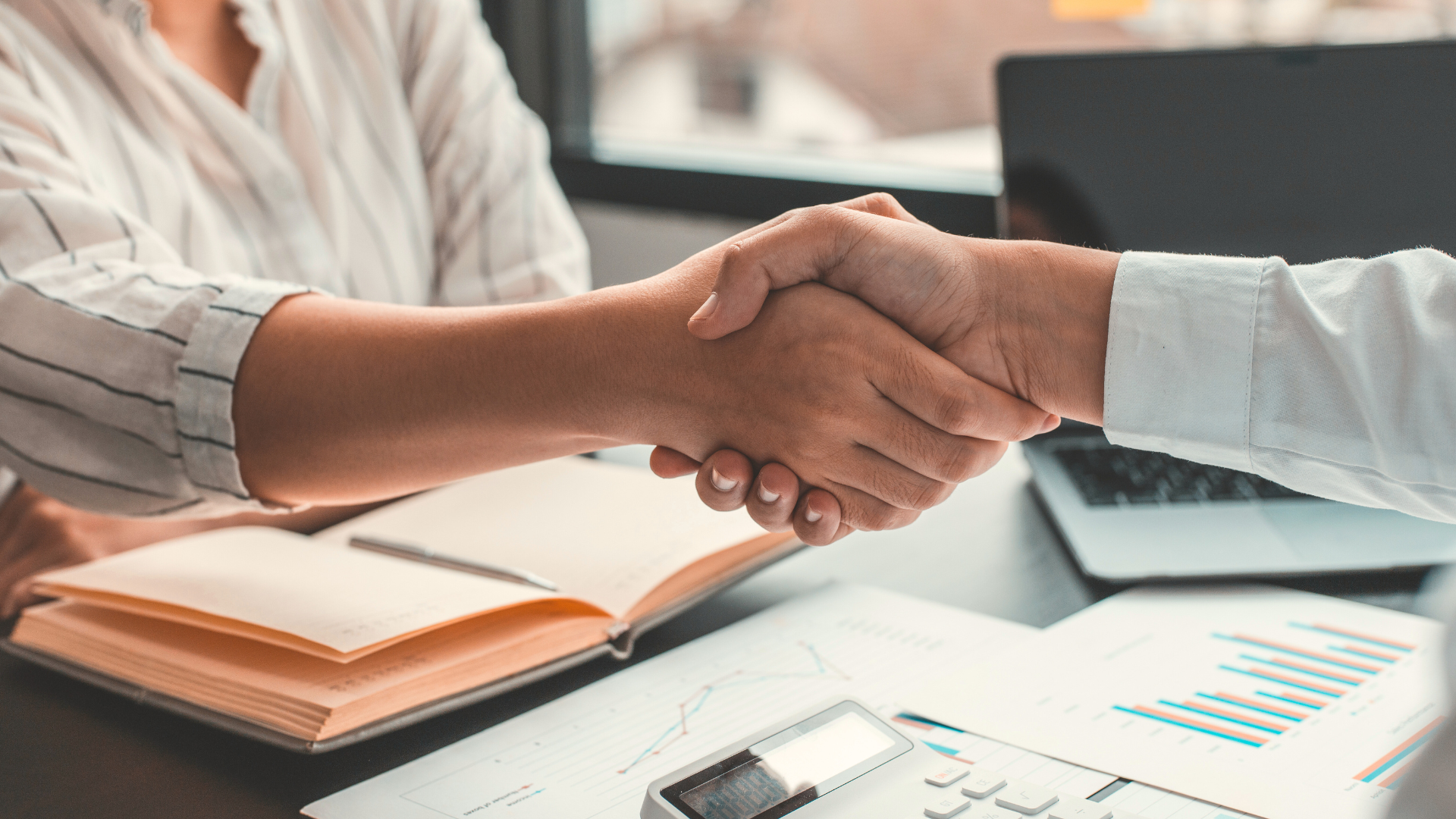 people shaking hands - Women in Tech UK